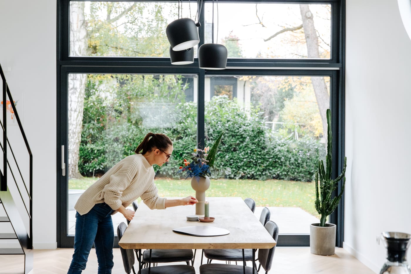 Floor-to-ceiling lift-and-slide door wall opening onto a garden