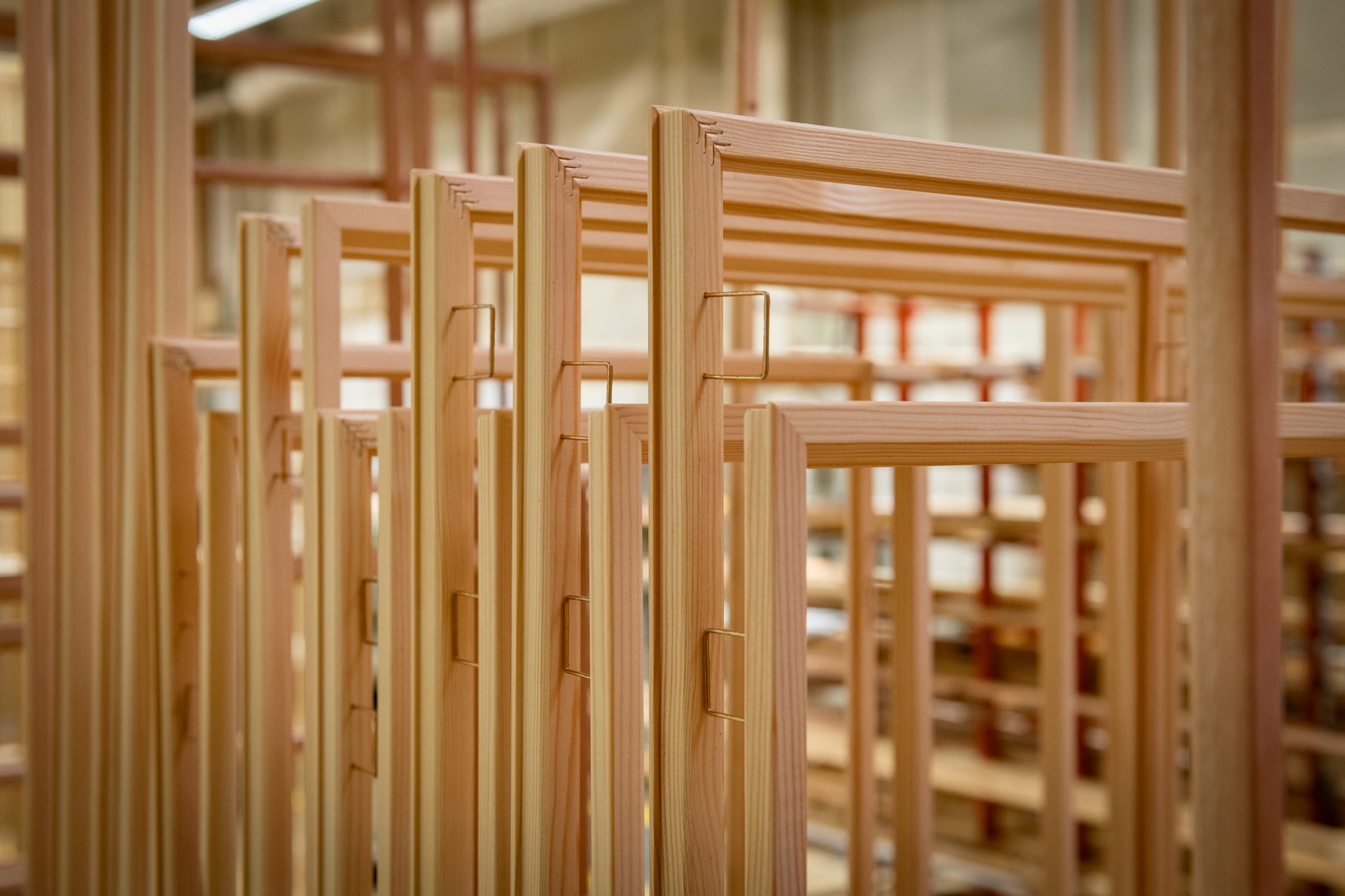Rows of hand-jointed wood window frames in the Sorpetaler production hall